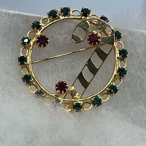 Vintage rhinestone wreath candy cane brooch.